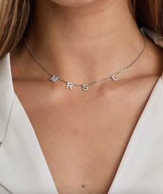 This necklace is truly one of a kind. Personalise with your brand new initial to make it exclusively yours. Perfect as a gift to show your other half just how much you care. Whether you layer with your favourite pieces, or wear it alone this necklace is one you won't ever want to take off! Shop the matching earrings here: https://www.etsy.com/uk/listing/1388074858 Details: - 925 sterling silver - 18K white gold plated - Gift ready in stunning jewellery box, with polishing cloth - Adjustable MRS Mrs Necklace, Married Gift, Jewellery Bridal, Gift For Bride, Necklace Wedding, Other Half, Wedding Jewellery, Bridal Jewellery, Letter Necklace