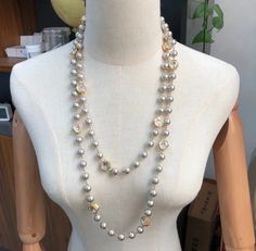 This elegant and timeless freshwater pearl and crystal necklace is perfect for any occasion. With its versatile design, it can be worn in layers for a more chic and sophisticated look. The combination of pearls and crystals adds a touch of luxury to any outfit. Upgrade your jewelry collection with this beautiful piece. Material: Alloy necklace with glass beads and freshwater pearls. Elegant Bridal Necklace With Pearl Chain And Crystal, Elegant Long Crystal Necklaces, Elegant Long Crystal Necklace, Luxury Pearl Embellished Necklaces For Parties, Elegant Crystal Necklace With Pearl Chain, Elegant White Crystal Necklace With Pearl Chain, Elegant Silver Crystal Necklace With Pearl Drop, Elegant Crystal Pearl Necklace For Party, Elegant Silver Pearl Crystal Necklace