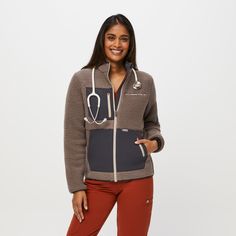 Why We Love ThisHappy hypothalamus. Designed with 380GSM of cozy thermal fleece and 12 pockets, the On-Shift™ Sherpa Jacket is engineered to keep your core warm.
Model Fit Description
Model is 59' / Wearing XS

Total of twelve pockets 
One chest pocket with zip
One sleeve pocket
One pen sleeve on sleeve pocket
One interior stethoscope pocket
One interior security pocket
One interior pen sleeve 
Two hand pockets
Two drop pockets
Two secure zip card pockets
380GSM of cozy fleece
Mock neck for prot Medical Attire, Scrubs Outfit, Scrub Jackets, Medical Scrubs, Women's Jackets, Sherpa Jacket, Scrub Pants, Model Fits, Shell Jacket