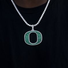 GLD has teamed up with the National Collegiate Athletic Association to introduce the official NCAA Team Pendants. This Large 14k White Gold piece was meticulously crafted with green hand-set stones to accurately depict the Oregon Ducks "O" Team Logo. Rep your squad with this official pendant to 'Win The Day!' . This product is guaranteed for life - GLD will repair the item should you experience any defects in craftsmanship or breakage. Pendant Specifications - 58mm x 48mm (Width x Height) - Weig Oregon Ducks Logo, Green Hand, Oregon Ducks, Gold Piece, Vermeil Jewelry, Custom Earrings, Pendant Bracelet, Drop Necklace, Chain Pendants