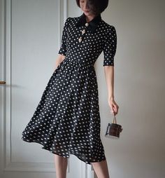 A classic polka dot dress full of elegance. This item has a noble atmosphere from the good old days, with attention to detail in the decoration. The high waist makes it look stylish, and the moderate length gives it a neat and elegant look. 
 
 
 
 
 
 
 
 
 
 Color 
 
 Black collar 
 White collar 
 
 
 Size 
 
 
 XS size 
 
 Length: 105cm 
 Shoulder width: 34.5cm 
 Bust: 80cm 
 Waist: 62cm 
 
 
 S size 
 
 Length: 109cm 
 Shoulder width: 35cm 
 Bust: 84cm 
 Waist: 66cm 
 
 M size 
 
 Length: 10 Elegant A-line Midi Dress For Vintage Fashion, 1950s Style A-line Polka Dot Dress, 1950s Style Formal Midi Dress, Elegant Vintage Midi Dress For Formal Occasions, Polka Dot Dresses For Vintage Fashion, Elegant Polka Dot Midi Dress For Spring, Vintage Fashion Polka Dot Dresses, Elegant Polka Dot Midi Dress For Evening, Elegant Black Vintage Dress For Summer