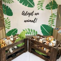 two wooden crates with stuffed animals in them