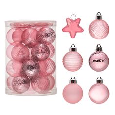 pink christmas ornaments are in a clear container