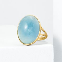 Ross-Simons - 25.00 Carat Aquamarine Ring in 14kt Yellow Gold. Size 10. With a sense of minimalistic style, this 25.00 carat oval aquamarine cabochon ring offers a timeless look with enduring appeal and an ethereal translucence. Set in polished 14kt yellow gold. 7/8" wide. Aquamarine ring. Aquamarine birthstones are the perfect gift for March birthdays. Modern Oval Cabochon Moonstone Ring, Modern Oval Topaz Ring For Formal Occasions, Modern 14k Gold Oval Cabochon Rings, Modern Aquamarine Oval Rings, Modern Oval Aquamarine Rings, Modern Oval Cabochon Moonstone Ring For Formal Occasions, Modern Yellow Gold Oval Moonstone Ring, Modern Oval Moonstone Ring For Formal Occasions, Modern Oval Yellow Gold Moonstone Ring