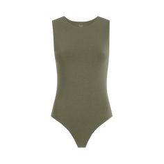 Seamless Second-skin Tops For Loungewear, Seamless Second-skin Top For Loungewear, High Stretch Cotton Tops With Seamless Construction, Modern Seamless Solid Tops, Modern Seamless Solid Color Tops, Fitted Cotton Bodysuit For Everyday Wear, Everyday Fitted Cotton Bodysuit, Stretch Ribbed Cotton Bodysuit, Summer Bodysuits