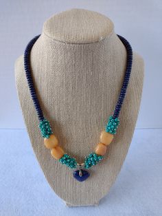 "This Stunning single strand OOAK necklace was made with Genuine Faceted Turquoise Rondelles, Orange Agate Nuggets and Lapis Lazuli Rondelles.  The Pendant is a tiny Lapis Lazuli Heart.  Findings are Silver Plate. Length:  Necklace - Apx 18\", Extender 2 1/2\", Pendant 1\"" Blue Pendant Beaded Necklace With Single Strand, Blue Agate Jewelry With Colorful Beads, Turquoise Agate Necklace With Colorful Beads, Handmade Turquoise Blue Agate Necklace, Handmade Blue Turquoise Agate Necklace, Handmade Blue Agate Turquoise Necklace, Unique Blue Single Strand Turquoise Necklace, Unique Blue Turquoise Single Strand Necklace, Orange Agate