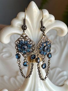 These cute boho inspired chandelier earrings measure about 2 inches long.  Will go with your favorite pair of jeans or that new spring dress!  Will be shipped USPS first class mail and free shipping. Ornate Metal Dangle Chandelier Earrings, Bohemian Blue Metal Chandelier Earrings, Blue Metal Bohemian Chandelier Earrings, Bohemian Blue Chandelier Earrings, Blue Rhinestone Dangle Earrings, Blue Bohemian Crystal Drop Earrings, Blue Bohemian Crystal Earrings, Bohemian Blue Crystal Drop Earrings, Vintage Blue Dangle Chandelier Earrings