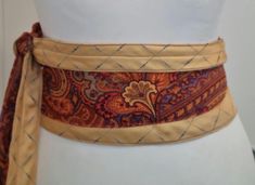 Pale yellow and burnt orange saffron paisley. Silk ties upcycled into a unique and one of a kind Japanese obi belt. 1 size fits most, it wraps around your waist and you can tie it at the front, side or back as in the video. This quirky and versatile belt can be dressed up or down: over a dress, over jeans and a basic top. It is stunning and will turn heads. An statement belt that makes the perfect Christmas and Birthday present. Obi Kimono, Kimono Belt, Japanese Obi, Statement Belt, Obi Belt, Unique Accessories, Quirky Gifts, Suspender Belt, Basic Tops