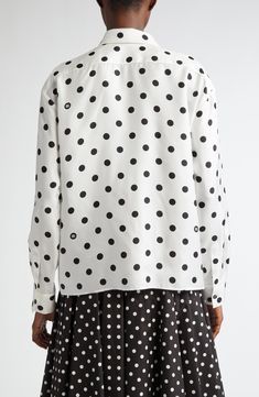 Bold polka dots add a playful spin to this silky button-up shirt from D&G's Mambo collection inspired by styles of the '40s and '50s. Front button closure Spread collar Long sleeves with button cuffs 100% silk Dry clean Made in Italy Designer Clothing White Button-up Shirt With All Over Print, White Graphic Print Button-up Tops, Chic Button-up Blouse With Graphic Print, Cotton Button-up Blouse With Graphic Print, White Graphic Print Button-up Blouse, Dolce And Gabbana Shirts, Silk Button Up, Polka Dot Shirt, Twill Shirt