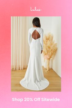 Make your special day even more so by making sure you walk down the aisle in the Lulus Eloquent Endearment White Long Sleeve Backless Maxi Dress! Stretchy crepe knit shapes this gorgeous dress that starts with a princess-seamed bodice, a crew neckline, and elegant long sleeves. The fitted waist tops an ultra-flattering, mermaid maxi skirt that boasts a romantic train at the back. A diagonal row of functional buttons secure above the flirty backless design, while a hidden zipper/clasp sits beneath a row of decorative buttons. Fit: This garment fits true to size. Length: Floor length. Size medium measures 60.5" from shoulder to hem. Bust: Great for any cup size. Waist: Fitted - very fitted at natural waist. Hip: Fitted - stretchy fabric allows room for hips. Undergarments: May be worn with a Elegant Wedding Dress With Sheer Back, Fitted Dress With Sheer Back For Wedding Night, Chic Wedding Dress With Cutout Back, Fitted Wedding Dress With Sheer Back, Fitted Wedding Dress With Keyhole Back, Chic Wedding Dress With Sheer Back, Backless Dresses With Cutout Back For Wedding, Backless Wedding Dress With Cutout Back, Chic Wedding Dress With Keyhole Back