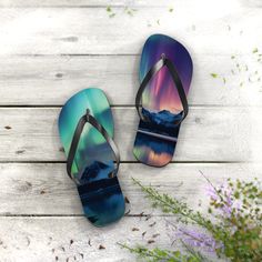 "All-day comfort is the name of the game when summer is on. With an easy slip-on aurora borealis design, a cushioned footbed, and top-tier printing fidelity, these flip flops are a must have! Key Features:  .: 5/8\" (15 mm) thick EVA sole .: 100% polyester suede sole cover .: Runs true to size .: Black PVC strap .: Multiple sizes Stay Connected: Follow us on Instagram (@phoenixbywombdesigns) for the latest updates, exclusive offers, and style inspiration. Explore our Pinterest page (@phoenixwombdesigns) for even more creative ideas and curated collections that ignite your artistic spirit." Dancing Lights, Norway Nature, Hip Hop Dancer, Dance Teacher Gifts, Nature Mountains, Black Pvc, Pet Memorial Gifts, Stil Inspiration, Eva Sole