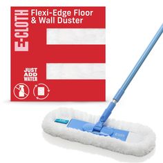 a blue mop is next to a box of floor and wall duster