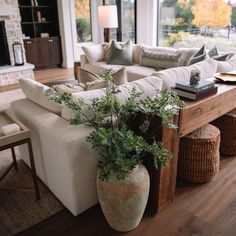 a living room filled with furniture and a large window