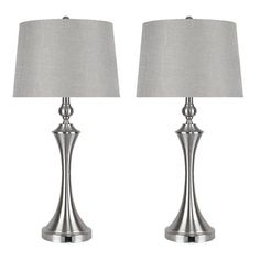 pair of modern metal table lamps with grey linen shades on each lamp, one is turned off and the other has a silver fabric shade