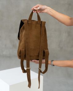 Suede soft backpack for women! Incredibly soft to touch, easy to wear, comfortable to use and stylish minimalist design! it's all about our cute backpack.  It is a stylish and comfortable accessory for studying or walking!  ⭐ Backpack made of soft brown suede, fastened with a drawstring with a lock.  ⭐ The shoulder straps are adjustable, so you can easily find the right size for wearing  ⭐ You can carry at your side, handhold, or wear it on your back. ⭐ Size: 13,4x9,4x5,1 in (34 x 24 x 13 cm) ⭐ Leather Backpack With Adjustable Strap For School, School Leather Backpack With Adjustable Straps, Back To School Leather Backpack With Adjustable Strap, Leather Satchel Backpack With Adjustable Straps For Daily Use, Casual Leather Backpack With Adjustable Straps For Daily Use, Everyday Leather Backpack For Back To School, Casual Leather Satchel Backpack With Adjustable Straps, Back To School Leather Softback Backpack, Everyday Leather Softback Backpack For Back To School