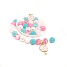 These adorable bracelet kits are the perfect activity for your little one's cotton candy themed birthday! Each bracelet kit includes one ready to string light pink enamel cotton candy charm with jump ring (no tools needed resin rhinestone beads, 20 10mm acrylic beads in light pink, bright pink, cyan and white and apx 12 inches of stretch cord. Each bracelet kit will be individually packaged in organza bags. This item is also available as premade bracelets in my shop. To be the first to know abou Cute Pink Craft Supplies With Round Beads, Pink Cute Round Beads Craft Supplies, Cute Pink Round Beads Craft Supplies, Pink Handmade Craft Supplies For Party Favors, Pink Birthday Bracelet With Lobster Clasp, Handmade Pink Craft Supplies For Party Favors, Playful Pink Craft Supplies For Gift Making, Personalized Playful Pink Craft Supplies, Spa Party Favors