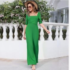 New Green Square Neck Short Sleeve Wide Leg Pant Jumpsuit This Womens Jumpsuits Features A Classic Square Neckline Adding A Touch Of Sophistication And Elegance To The Jumpsuit, Creating A Three-Dimensional And Layered Look That Is Sure To Turn Heads, While The Ruched Bodice Adds A Touch Of Glamour And Accentuates Your Curves. It's A Timeless Piece That Will Make You Stand Out. Wide Flowy Leg Short Sleeves Zipper Back Square Neckline Polyester And Elastane Size Large New Without Tags Fitted Wide Leg Jumpsuit Or Romper In Solid Color, Fitted Green Jumpsuit, Spring Stretch Wide-leg Jumpsuits And Rompers, Elegant Solid Color Summer Jumpsuits And Rompers, High Waist Solid Jumpsuits And Rompers For Summer, Non-stretch Wide Leg Jumpsuits And Rompers For Summer, Spring Date Night Stretch Jumpsuits And Rompers, Green Fitted Short Sleeve Jumpsuit, Fitted Solid Color Jumpsuit For Beach