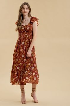 Expertly designed with a sweetheart neckline and double ruffled sleeves, the Carmela Floral Midi Dress is a must-have for any fashion-forward individual. The ruched bust and smocked underbust provide a flattering silhouette, while the lined, floral print fabric adds a touch of elegance. Perfect for all occasions. 100% Polyester Fitted Midi Dress With Smocked Bodice And Ruffled Straps, Bohemian Dress With Smocked Bodice And Ruffled Straps, Bohemian Ruched Dress With Ruffled Straps, Bohemian Dress With Ruched Detail And Ruffled Straps, Brown Square Neck Dresses With Ruffles, Casual Ruffle Dress With Sweetheart Neckline, Casual Midi Dress With Ruffled Fitted Bodice, Flowy Smocked Dress With Ruffles And Empire Waist, Fitted Brown Smocked Dress With Ruffles