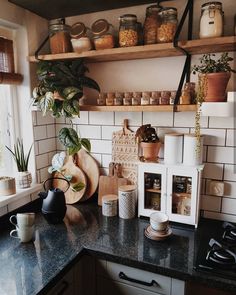 a kitchen counter with pots and pans on it