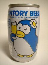 a can of beer with a cartoon penguin holding a glass in it's hand