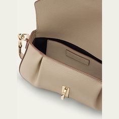 Stuart Weitzman "Milan" shoulder bag in leather  Detachable shoulder strap Envelope flap top with turn-lock closure  Approx. 3.7"H x 6.7"W x 4.3"D Professional cleaning recommended Made in Italy Elegant Double Flap Bag With Gold-tone Hardware, Luxury Flap Bag For Formal Occasions, Timeless Double Flap Bag With Gold-tone Hardware, Beige Double Flap Evening Shoulder Bag, Beige Double Flap Shoulder Bag For Evening, Designer Double Flap Satchel For Formal Occasions, Designer Double Flap Satchel For Formal Events, Beige Top Handle Flap Bag With Magnetic Closure, Beige Double Flap Bag With Detachable Strap