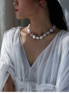 Experience the rebellious charm of our Elegant Rebellion Baroque Pearl Statement Necklace. This unique necklace breaks stereotypes with its refreshing twist on classic pearl jewelry. Versatile and sophisticated, it adds a touch of elegance to any outfit. With delicate golden accents and real-life texture, it's a perfect fashion statement that celebrates individuality and the unexpected. Metal: 18K Recycled Gold Plated On Brass Gemstone:Freshwater Baroque Pearl Pearl Dimensions:18mm Chain Length: 390mm+50mm extension chain Pearl White Baroque Pearl Clavicle Necklace, White Baroque Pearl Necklace With Clavicle Chain, Luxury Baroque Pearl Necklaces, Elegant Baroque Pearl White Necklace, Elegant Baroque Pearl White Pearl Necklace, Luxury White Baroque Pearl Necklaces, Baroque Pearl White Necklaces, Baroque Pearl White Necklace, Baroque Pearl White Pearl Necklace