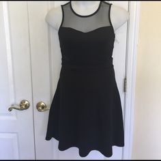 You Will Be The Center Of Attraction In This Black Sleeveless Dress By Kandy Kiss. Featuring Round Neck, Tulle On The Neck, And Both Sides Of The Front Waist, Sexy Yet With Class. Sleeveless, Fit And Flare And Zipper At The Back For Easy Wear. Body: 95% Polyester 5% Spandex Contrast: 100% Polyester Machine Wash Black 6 35” Shoulder To Hem 15” Armpit Laying Flat 13” Waist Laying Flat Stretch Sleeveless Dress With Flattering Silhouette For Party, Fitted Sleeveless Sequin Dress, Fitted Sleeveless Mini Dress, Black Flirty Sleeveless Evening Dress, Black Fit And Flare Sleeveless Mini Dress, Black Sleeveless Fit And Flare Mini Dress, Flirty Black Sleeveless Dress For Evening, Flirty Black Sleeveless Evening Dress, Fitted Dressy Sleeveless Dress