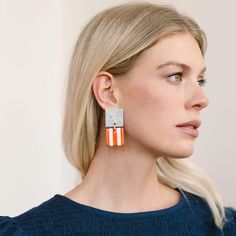 We love a little pattern play, which is why we're excited to introduce the Bloom Double Block Earrings that mix light blue flowers with bold red stripes. Color: blue, red, white and gold Size: 2" x 1" Lightweight Buffalo horn Stainless Steel ear post Your earrings are made from all-natural material and as such the horn color may vary slightly from what is shown. While all horn is very similar in appearance, no two are exactly the same. This guarantees the uniqueness of each piece and ensures you Sarong Dress, Candle Bar, Light Blue Flowers, The Horn, Summer Gifts, Pattern Play, Pool Days, Dress Gift, Dress Cover