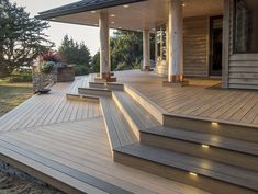 a large wooden deck with steps leading up to it