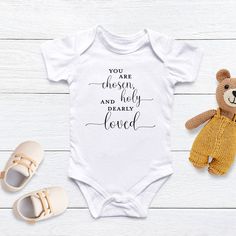 You are chosen, holy and dearly loved!This super soft onesie is a perfect gift for a baby shower, baptism and newborn. What a way to welcome one of God's most precious gifts! Baby clothing needs to be both durable and soft. With the infant fine jersey bodysuit, youths get just that. There are seams along the sides of this product. All bindings are made with ribbed knitting for improved durability. There are plastic snaps at the cross closure for easy changing access. Partner with our You Are Cho White Short Sleeve Onesie For Baptism, Diy Shirts, Free Labels, Gifts Baby, Baptism Gifts, Silhouette Crafts, Diy Shirt, Christian Clothing, Crochet Scarves