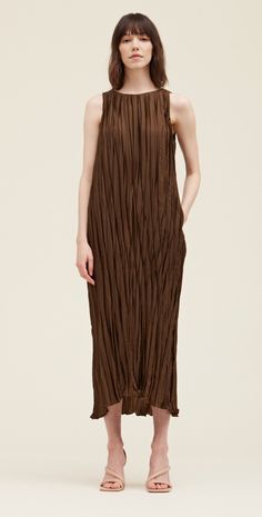 This pleated midi is such a gorgeous rich color. This simple silhouette is elevated with the beautiful pleated fabric with a little sheen and features pockets and a tie at the waist. Fabric & Care 100% Polyester Hand wash, Hang to dry Sizing True to size, relaxed fit. Palmer Alaska, Brown Midi Dress, Simple Silhouette, Pleated Maxi Dress, Pleated Fabric, Pleated Maxi, Pleated Midi Dress, Loungewear Sets, Print Tunic