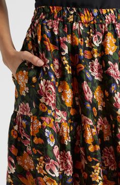 Carefully tucked pleats bring graceful movement to this flowy tie-waist maxi covered in delightful blooms. 38 1/2" length (size Medium) 100% cotton Dry clean Imported Fall Floral Skirt, Floral Print Full Maxi Skirt With Voluminous Fit, Floral Print Full Maxi Skirt, Voluminous Floral Print Full Maxi Skirt, Cotton Tiered Skirt Maxi Dress For Garden Party, Cotton Tiered Maxi Dress For Garden Party, Cotton Maxi Dress With Tiered Skirt For Garden Party, Summer Floral Print Maxi Skirt For Daywear, Green Floral Print Maxi Skirt