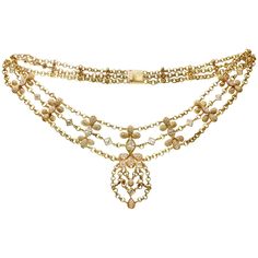 This exquisite Chatila necklace is crafted in 18k yellow gold and is composed of three rolo chains, pear-shaped elements pave-set with E-F VVS1-VVS2 diamonds and accented with square and marquise-cut diamonds bezel-set in 18k yellow gold. The center marquise-cut diamond weighs an estimated 0.75 carats, the fancy-cut diamonds weigh between 0.20 to 0.40 carats each, and 312 round brilliant-cut diamonds weigh an estimated 4.50 carat. In total, there is about 330 diamonds weighting an estimated of 9 Luxury Ethereal Yellow Gold Jewelry, Luxury Gold Diamond Necklace With Pave Setting, Luxury Yellow Gold Diamond-shaped Necklace, Luxury Round Yellow Gold Bridal Necklace, Luxury Vintage Box Chain Necklace, Luxury Antique Gold Chain Necklace, Luxury Exquisite Yellow Gold Diamond Necklace, Vintage Diamond Necklace, Haute Jewelry