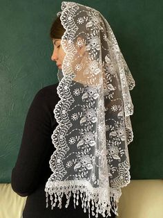 A beautiful cathedral veil is made of delicate silky lace. Gorgeous mantilla of tender white. Edges lace mantilla chapel are processed by beautiful sewing that gives tenderness and refinement. Lovely mantilla veil. 150 cm long x 48 cm wide Chapel veil can be made in other sizes by custom order. Lace mantilla suitable for orthodox mantilla, bridal veils, catholic mantilla,mass, First Holy Communion and Confirmation, mothers day gift Instructions for use: Wash by hand and dry on a smooth surface. Do not iron. Traditional Lace Shawl With Lace Trim, Traditional White Veil, Wedding Lace Shawl Dupatta, Wedding Lace Dupatta Shawl, Lace Dupatta Shawl For Wedding, Lace Dupatta With Lace Trim, White Lace Trim Shawl For Wedding, White Lace Shawl For Wedding, White Lace Shawl With Lace Trim