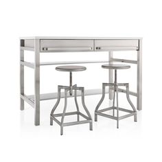 two stools and a table with an open shelf on the top, one is silver