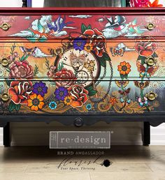 an ornate painted chest with flowers and birds on it