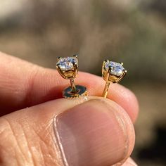 Men's and women's 1ct moissanite stud earrings. 1CT -5MM each stone (0.5ct each round stone). 14k gold vermeil over solid 925 sterling silver. Passes the thermal diamond test (test pen). Will show up as Moissanite on a lab analysis. Beautiful dazzling rainbow disco-ball effect. The moissanite shines so hard it will blind you. Stylish and secure screw back fasteners. Will never ever turn your skin or ears green. Buy with confidence with 30 day returns. 100% FREE SHIPPING in USA. Order now! Moissanite Earrings, Hip Hop Jewelry, Disco Ball, Solid 925 Sterling Silver, Gold Vermeil, Screw, 925 Silver, Gold Plate, Lab