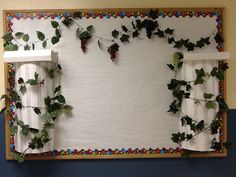 a bulletin board with ivy growing on it