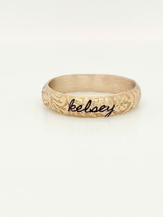 The Blume Ring This floral stacking ring is available in 14k yellow gold filled OR 14k solid gold and makes a perfect gift for yourself, wife, mom, or loved one!This listing is for ONE ring. This stacking ring features a floral pattern wrapped around the entire band. Combine it with a personalized ring for a cute, everyday look! Engraving Option Round Band For Promise Ring, Adjustable Sterling Silver Engraved Ring Stamped 14k, 14k Gold Filled Round Band Jewelry For Anniversary, 14k Gold Flower Ring For Anniversary With Round Band, 14k Yellow Gold Hand Stamped Engraved Ring, 14k Yellow Gold Engraved Ring With Hand Stamped Details, 14k Gold Anniversary Flower Ring With Round Band, Adjustable 14k Gold Hand-stamped Rings, Adjustable 14k Gold Hand Stamped Rings