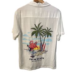 Denim And Flower By Ricky Singh Palm Beach Flamingo Graphic Shirt Men S White Beach Usa Vacation New Lightweight Sheer Approximate Measurements Lying Flat Chest 38.50 Length 26.50 Summer Camp Shirt With Camp Collar For Vacation, White Camp Collar Top For Vacation, Graphic Print Camp Collar Hawaiian Shirt For Beach Season, Beach Season Camp Shirt With Palm Tree Print, Beach Shirt With Camp Collar And Graphic Print, White Hawaiian Shirt With Camp Collar For Vacation, Summer Camp Shirt With Palm Tree Print And Collar, Beach Season Graphic Print Camp Shirt, Beach Season Camp Collar Shirt With Graphic Print