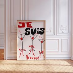 a framed poster with the words je suis on it in front of a white wall