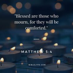 many lit candles with the words,'blessed are those who mourn, for they will be comforted '