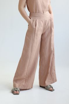 "Wide linen long pants. Cut from medium weight linen, they have a comfortable elasticated waist at the back and wide-leg shape. You will always stand out and feel super stylish wearing them. We recommend them in any solid linen color or sophisticated Exclusive colors. Wear them with any shoes, from your highest heels to sneakers. ABOUT US LINEN ID was born from desire to embrace things that actually matter. We aim to create sustainable garments that offer uncompromised design, are versatile and Elegant Wide Leg Linen Pants With Elastic Waistband, Elegant Linen Wide Leg Pants With Elastic Waistband, Linen Full-length Harem Pants For Spring, Full Length Linen Harem Pants For Spring, Spring Full Length Linen Harem Pants, Spring Linen Harem Pants, Relaxed Fit Linen Wide Leg Pants, Baggy Wide Leg Flax Pants, Bohemian Wide Leg Linen Pants With Pockets