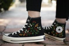 🌺 Love Embroidered Converse Shoes   Each new pair of shoes from brand's store. Each pair is HAND EMBROIDERED to order, please make sure you put in the correct shoe size before you check out. The embroidery is durable and will not fade away. You will receive Converse shoes with Floral Embroidery Designs as pictures. 🌺Create your unique vibe by your own design of embroidery!  Contact me for your own embroidered shoes with your Private Listing! The embroidery can be designed from: - Your favorite flowers / animals / images... - Your flowers / bouquet wedding photos... In their site, Converse recommend buying a half-size down because in general, Converse fit bigger than your average shoe. But we would only recommend this if you have narrow feet, because Converse Chuck Taylor All Stars and Co Floral Embroidery Designs, Converse Chuck 70s, Embroidery Converse, Converse Fits, Chuck Taylor 70, Embroidered Converse, Custom Chuck Taylors, Converse Custom, Narrow Shoes