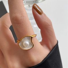 Stunning real natural freshwater pearl and shell statement cocktail chunky ring, open adjustable ring. White shell signet with natural pearl paved in the center, 14k rose gold plated finish. Super unique and creative, elevate your dainty vibes, easy to stacking. Perfect gift to treat yourself and your friends/family, you will get lots of compliments for sure! ♥ All of our jewelry are carefully handmade with delicate and exquisite details, all designed and made in Manhattan, New York. 💎 Features Statement Rings Chunky, Pearl Clam, Ring Y2k, Statement Rings Unique, Pearl Rings Vintage, Mother Of Pearl Ring, Bling Ring, Chunky Ring, Shell Ring