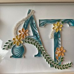 the letters are made out of paper and decorated with flowers