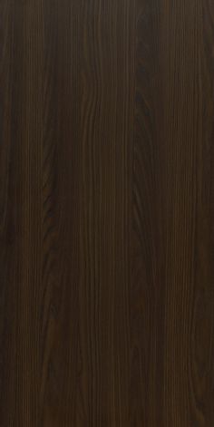 a close up view of the wood grains on this paneled wall, which is dark brown in color