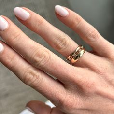 This ring is inspired by string lights. It's meant to be stacked between two other rings so that it looks like the diamonds are floating in the space between. The ring has a super fine piece of metal connecting the 5 diamonds across the top and a solid, rounded band on the bottom for comfortable wear. Anniversary Stackable Open Rings, Rose Gold Stackable Round Cut Rings, Stackable Open Diamond Ring For Promise, Modern Twist Diamond Cut Ring For Anniversary, Modern Style Diamond Cut Rings For Anniversary, Modern Twist Round Cut Rings For Anniversary, Promise Stackable Open Rings, Modern Twist Open Ring For Wedding, Diamond Wide Band Ring With Tension Setting For Wedding