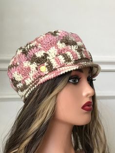 a mannequin head wearing a crocheted hat