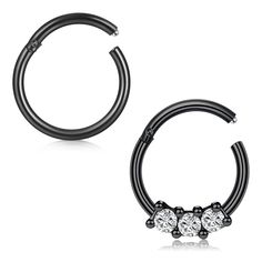 pair of black nose rings with three stones on each end and an earring in the middle